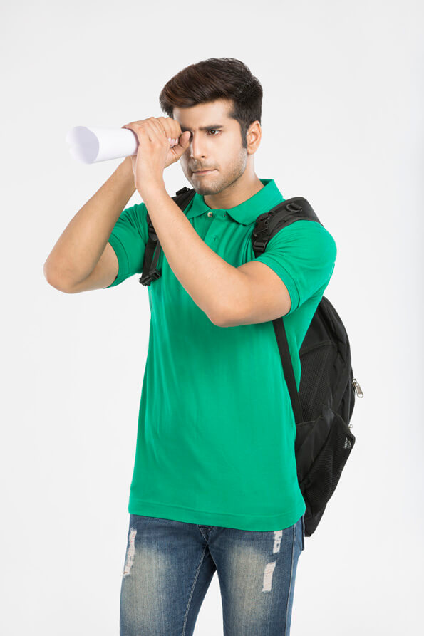 guy carrying backpack looking through rolled sheet of paper