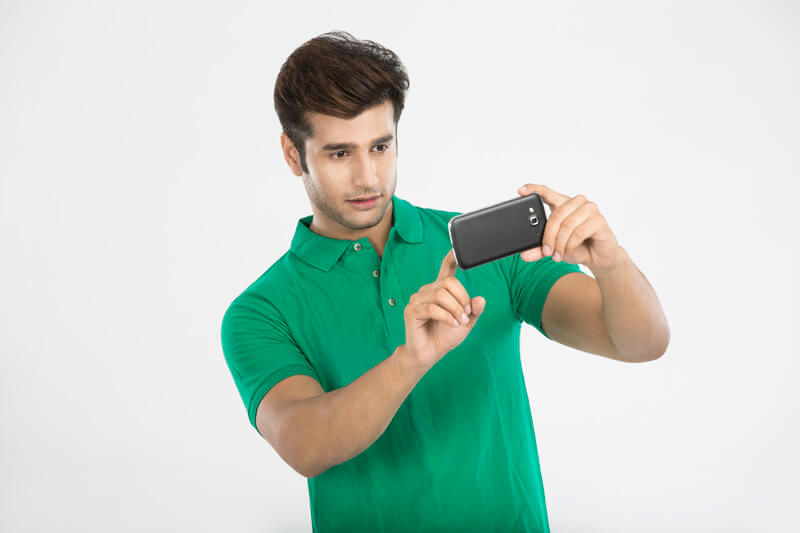 man clicking picture from mobile phone 