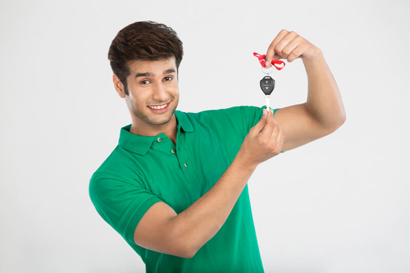 man showing car key as gift 