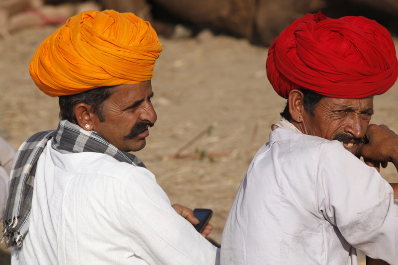 rajasthani men wearing turbans and sitting 