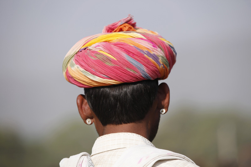 back side of a man wearing turban 