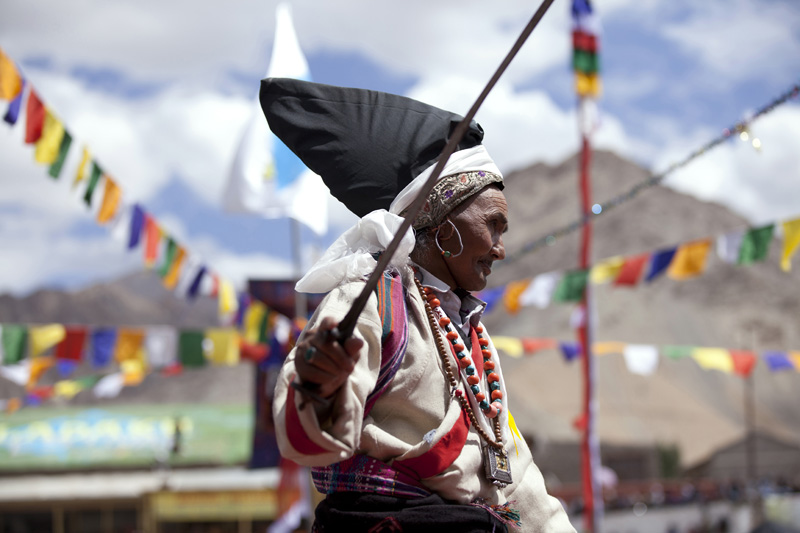 old traditional tibetan woman performing folk dance