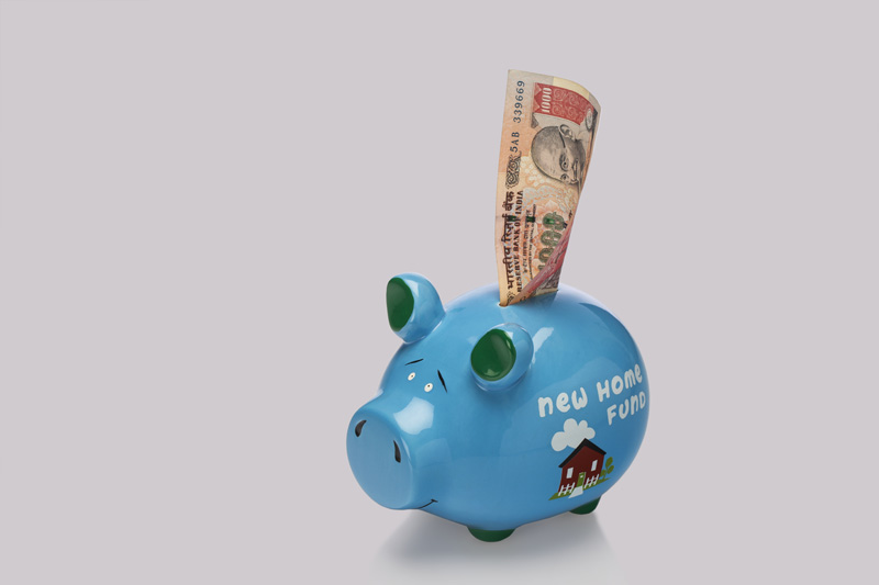 piggy bank with 1000 rupee note