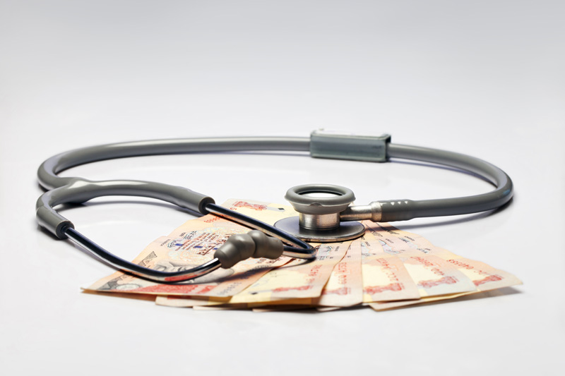 stethoscope and cash