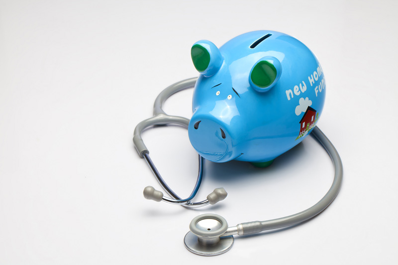 piggy bank with stethoscope  