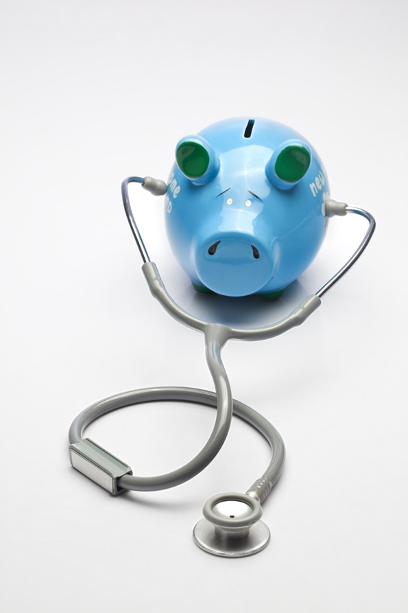 piggy bank with stethoscope 