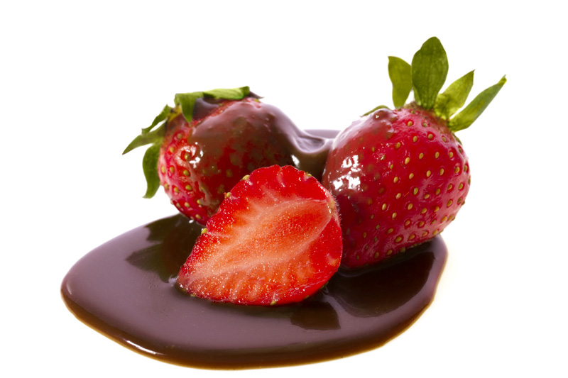 chocolate flavored red strawberries against white background