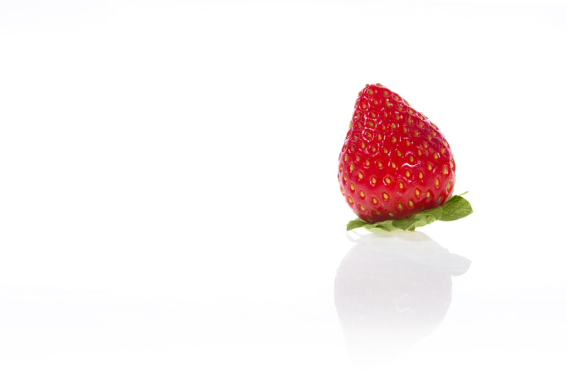 only strawberry against w hite background with copy space