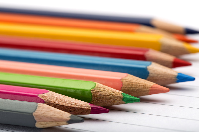 multi coloured pencils in a row