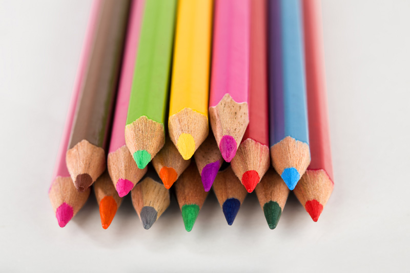 pencil colours arranged against white background 