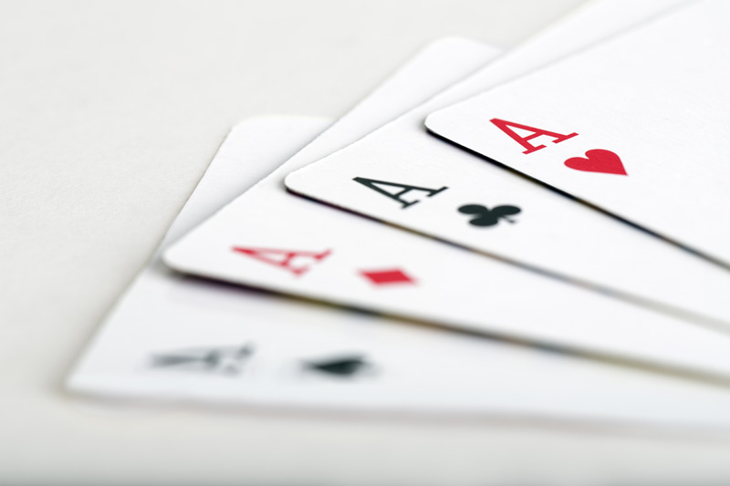 set aces on table with white background 