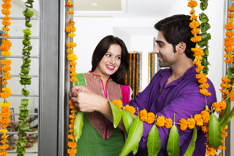 couple looking at each other while decorating their new home