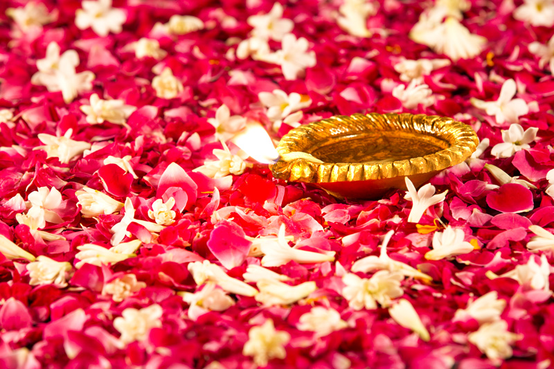 diya placed on rose petals
