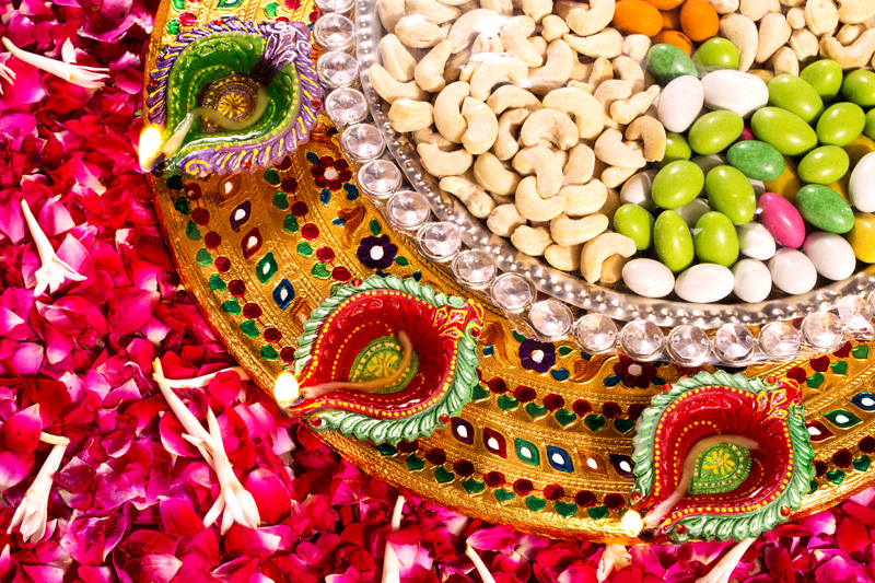 pooja thaali with diyas and dry fruits 
