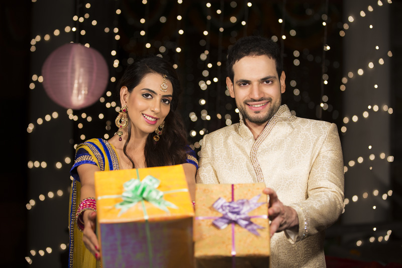 couple showing off their diwali gifts