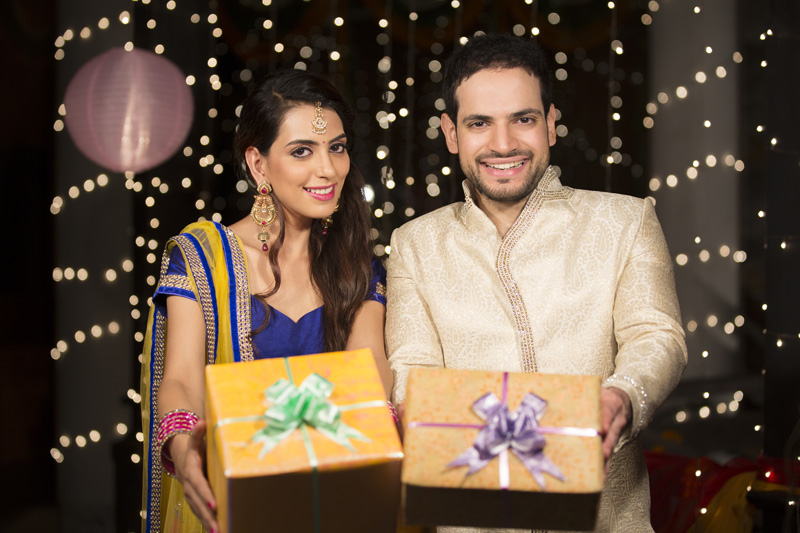couple with diwali gifts