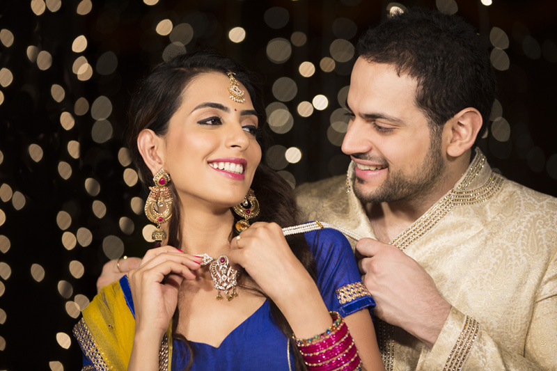 husband gifting necklace to his wife on diwali 