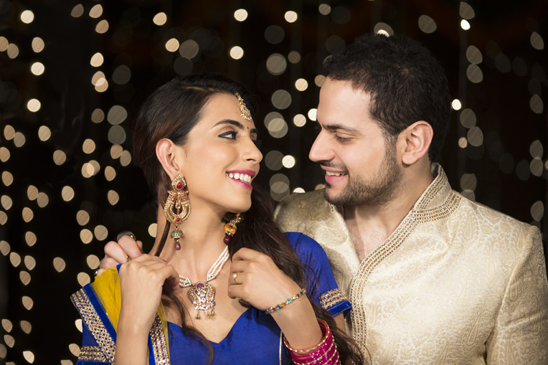 husband gifting necklace to his wife on diwali 
