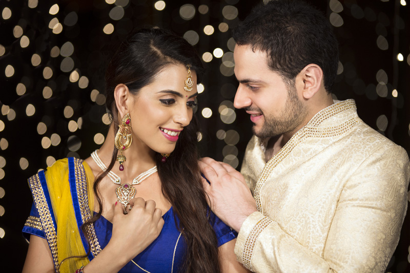 man giving necklace to his wife on the occasion of diwali