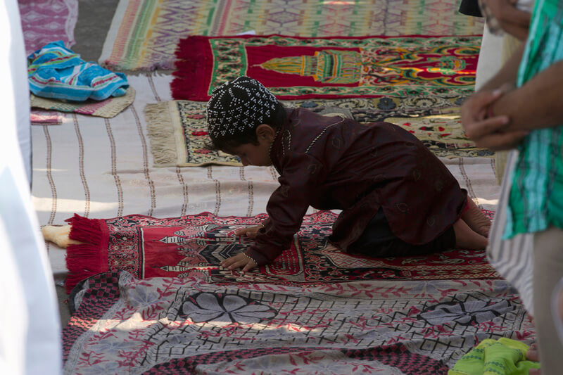 child playing at mosque during eid celebrations