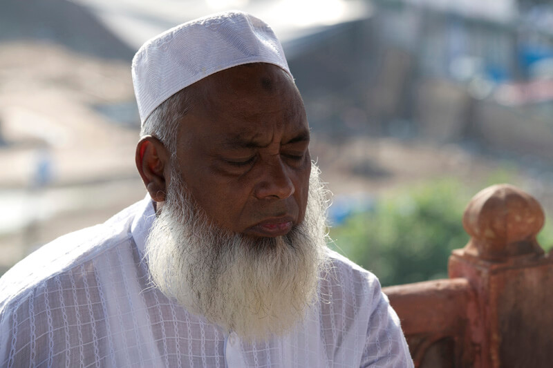 old muslim man at mosque praying 
