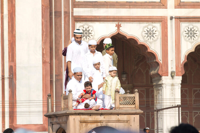 people along with children at jama masjid