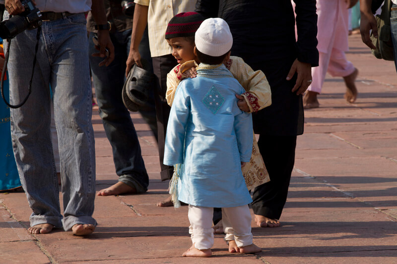 children embracing each other during eid festival 