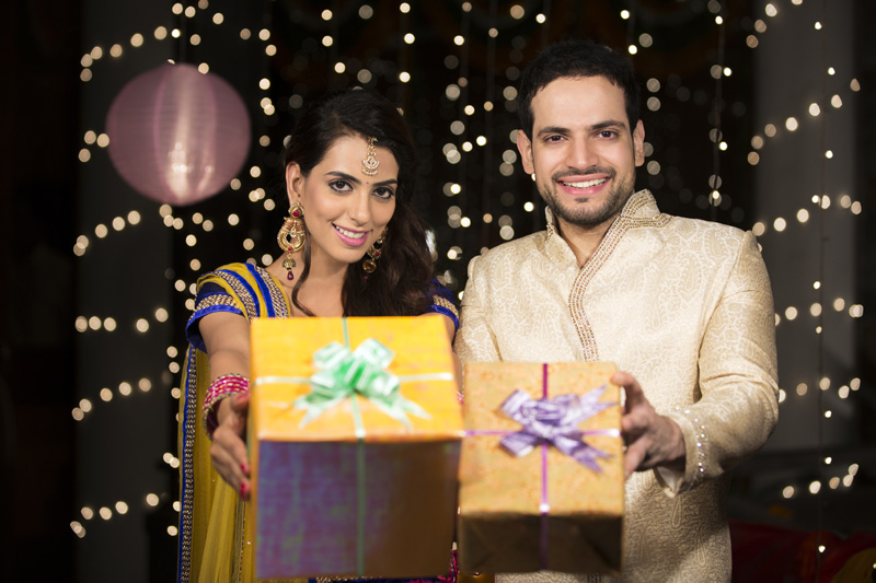 couple with diwali gifts  