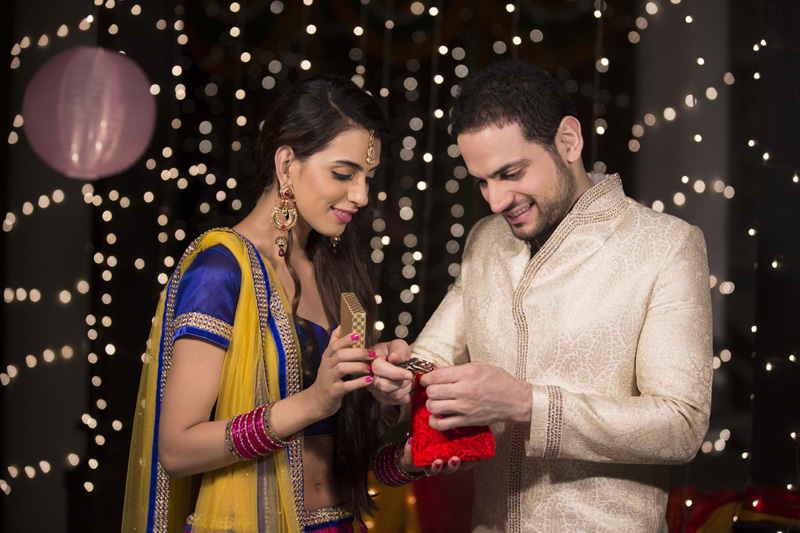 wife gifting her husband a watch on diwali 