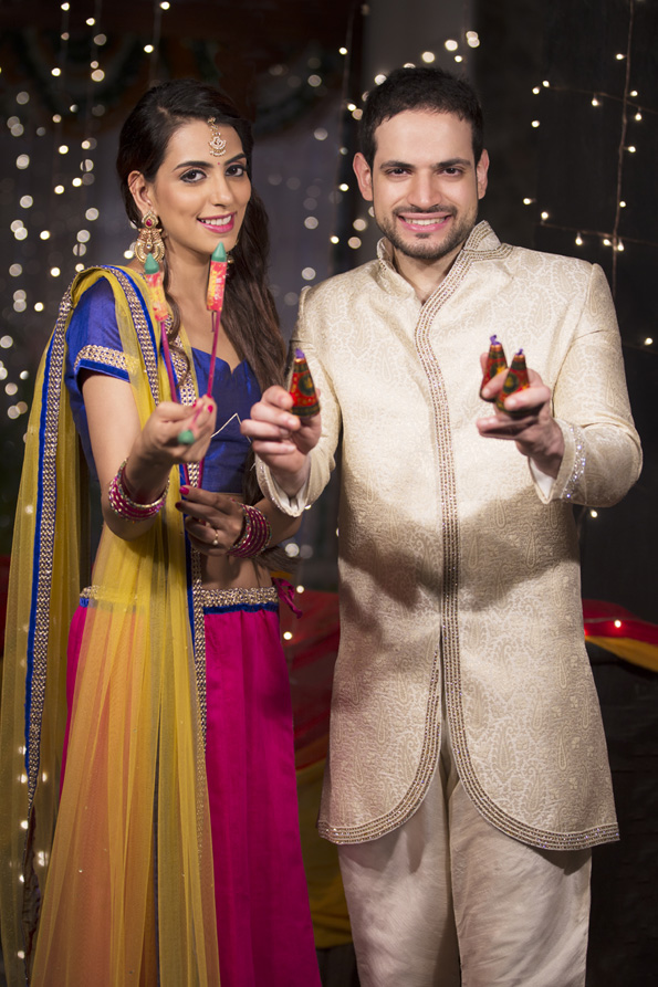 couple with crackers on diwali 