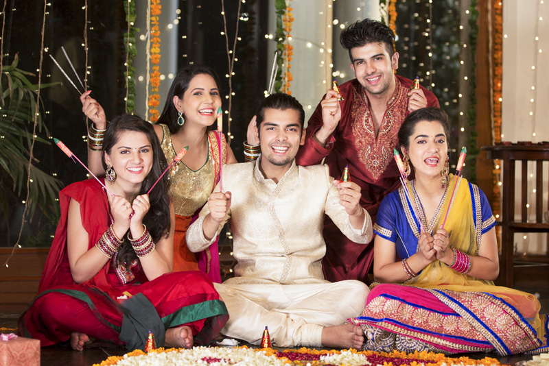 couples celebrating diwali with crackers 