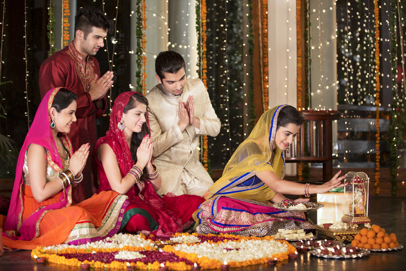 couples doing diwali pooja