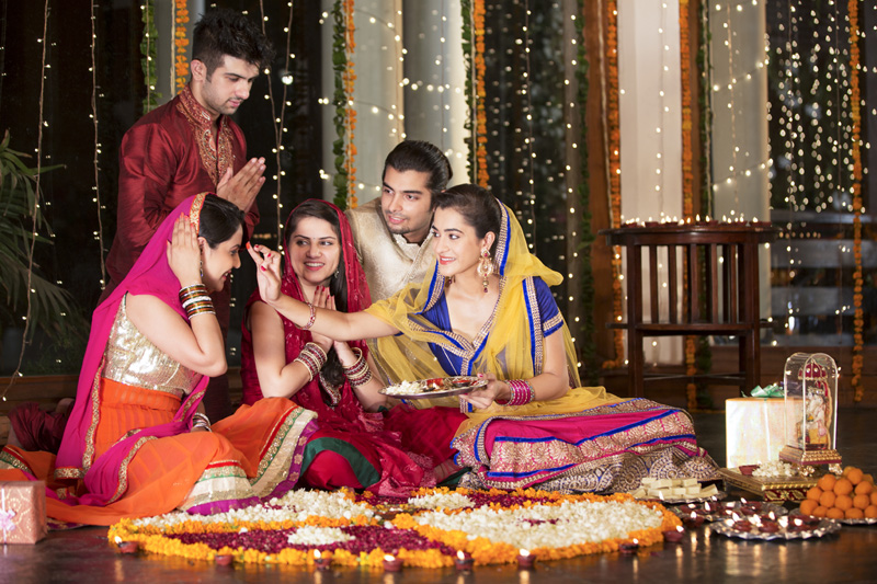 couples doing diwali pooja