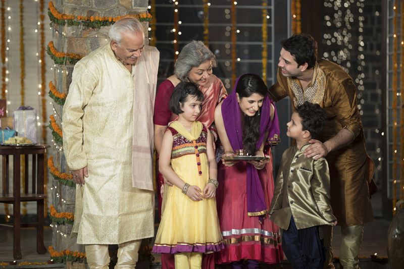 family doing diwali pooja 