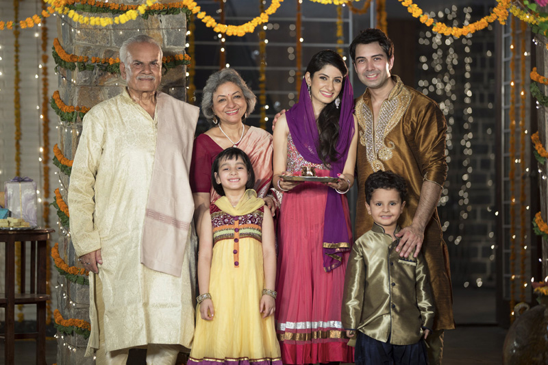 complete family in traditional wear on diwali and posing
