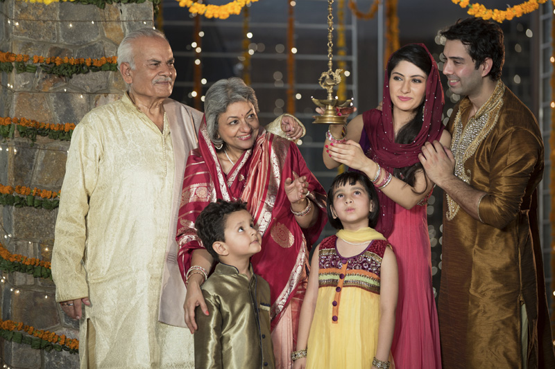 family doing diwali pooja 