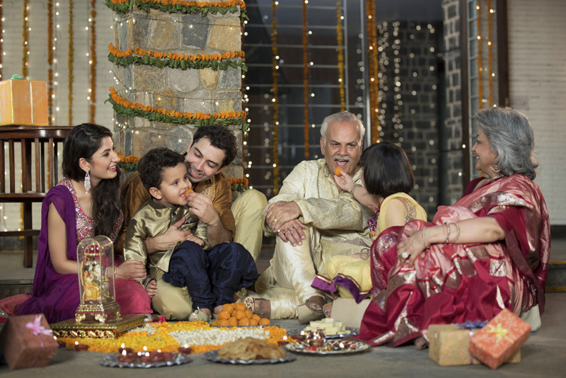  family celebrating diwali together 