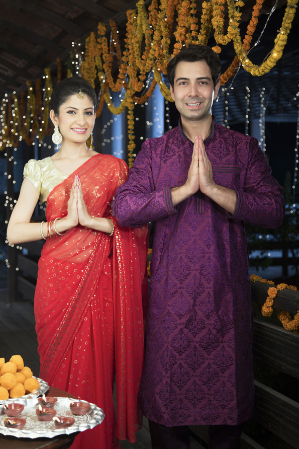 diwali couple welcoming guests