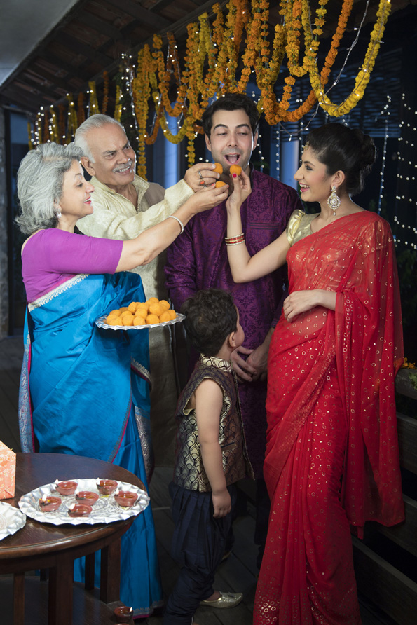 traditional family celebrating diwali