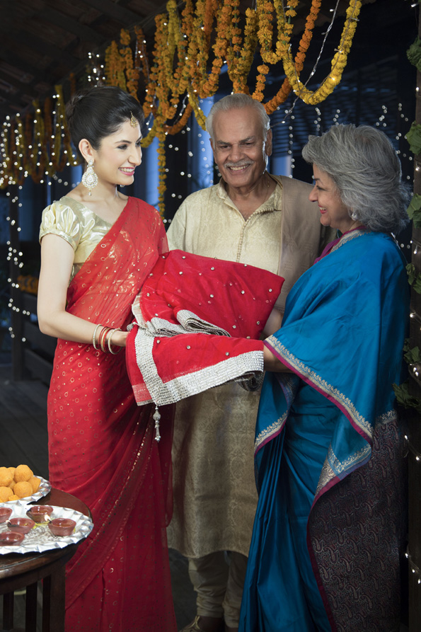 housewife with her in laws celebrating diwali