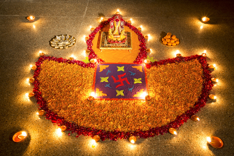 flower rangoli and diyas on diwali 