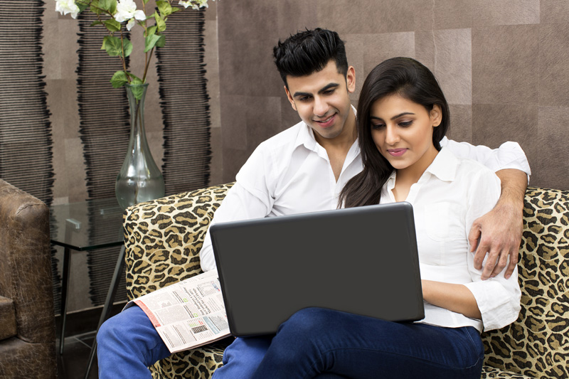 couple browsing in laptop
