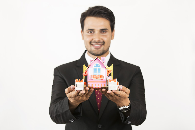 real estate agent showing home miniature 