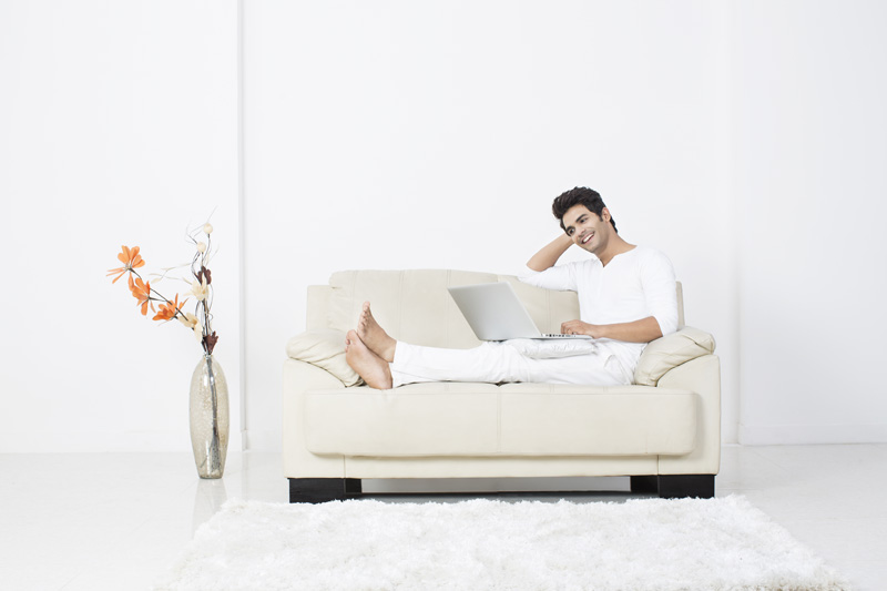 man with laptop having leisure time at home