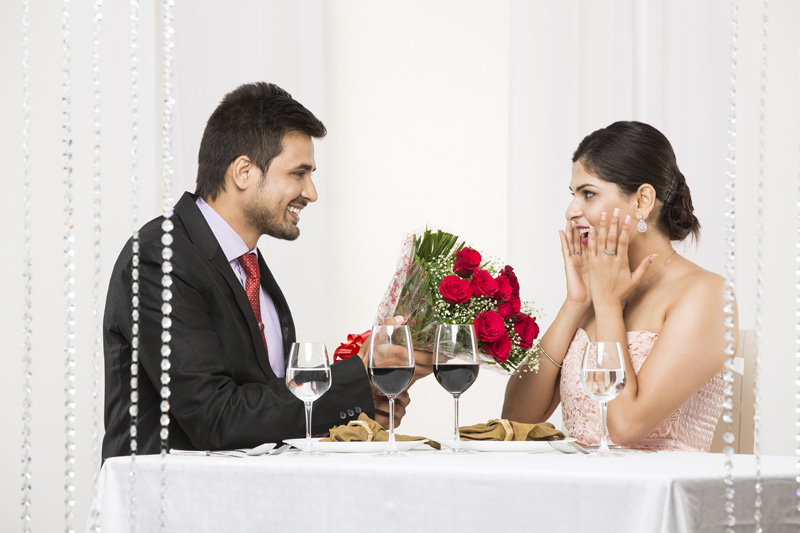 couple in excitement on dinner table 