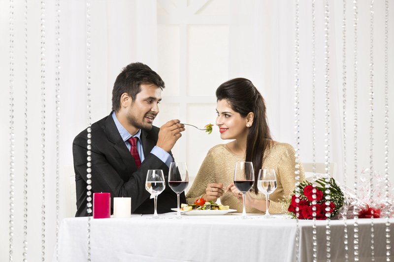 couple having romantic dinner at restaurant