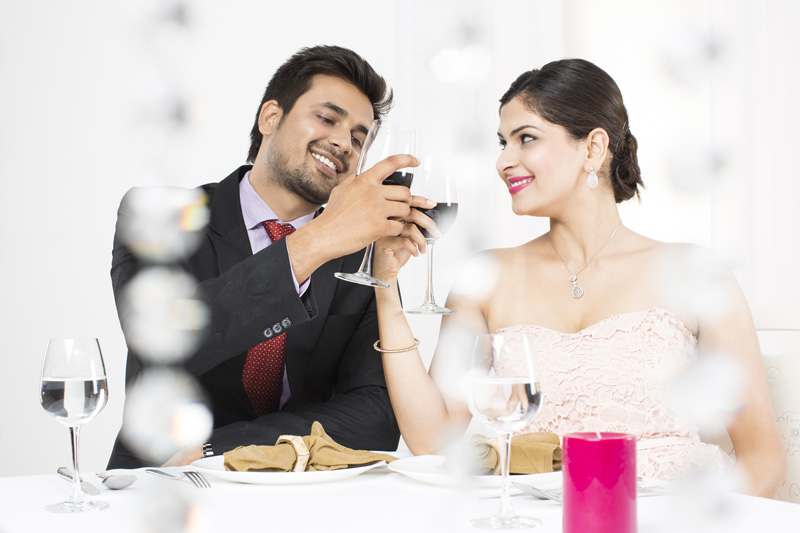 couple sipping wine at restaurant