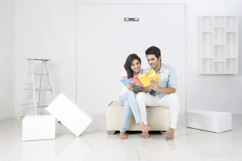 couple in new home deciding wall paint colour