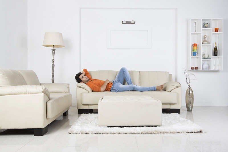 man resting on couch