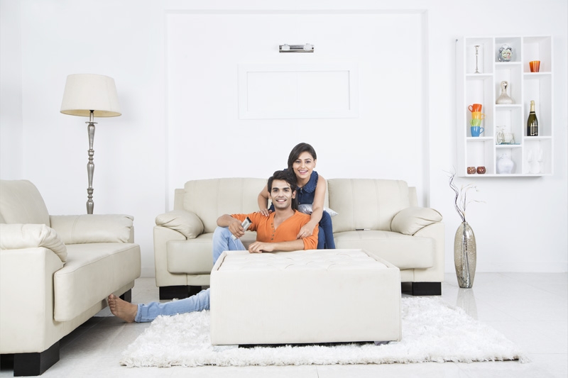 couple watching television and smiling